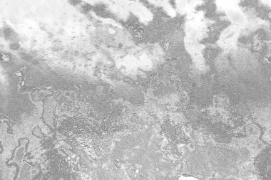 Çizik ve çatlaklarla dolu gri bir doku.