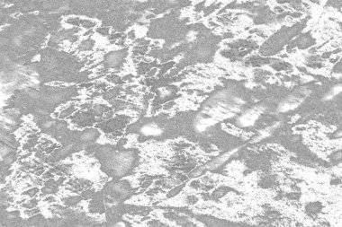 Çizik ve çatlaklarla dolu gri bir doku.