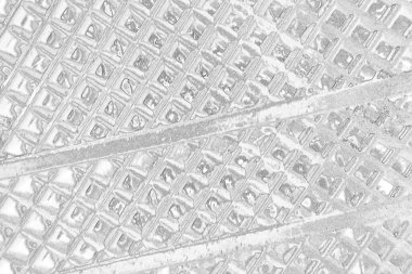 Çizik ve çatlaklarla dolu gri bir doku.