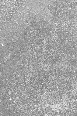 Çizik ve çatlaklarla dolu gri bir doku.