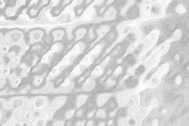 Çizik ve çatlaklarla dolu gri bir doku.