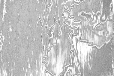 Çizik ve çatlaklarla dolu gri bir doku.