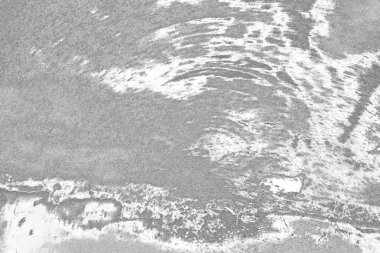 Çizik ve çatlaklarla dolu gri bir doku.