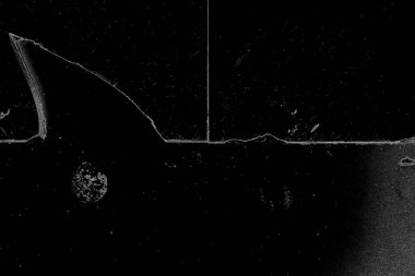 Çizik ve çatlaklarla dolu gri bir doku.