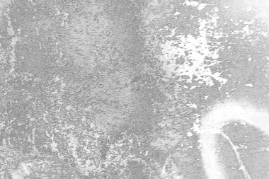 Çizik ve çatlaklarla dolu gri bir doku.