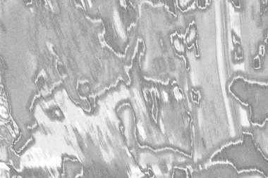 Çizik ve çatlaklarla dolu gri bir doku.