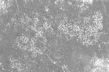 Çizik ve çatlaklarla dolu gri bir doku.