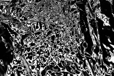 Çizik ve çatlaklarla dolu gri bir doku.