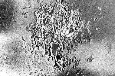 Çizik ve çatlaklarla dolu gri bir doku.