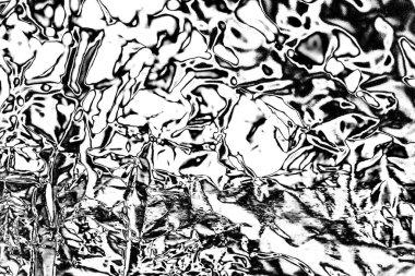 Çizik ve çatlaklarla dolu gri bir doku.