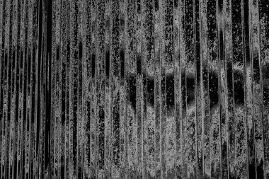 Çizik ve çatlaklarla dolu gri bir doku.