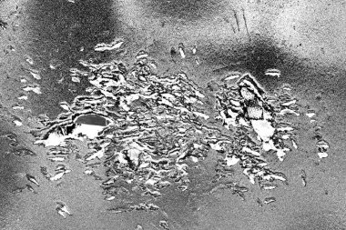 Çizik ve çatlaklarla dolu gri bir doku.