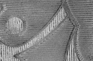 Çizik ve çatlaklarla dolu gri bir doku.