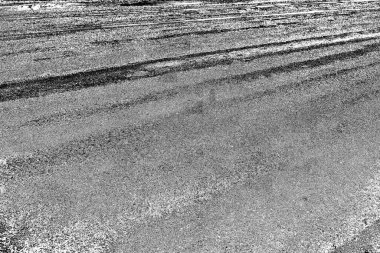 Çizik ve çatlaklarla dolu gri bir doku.