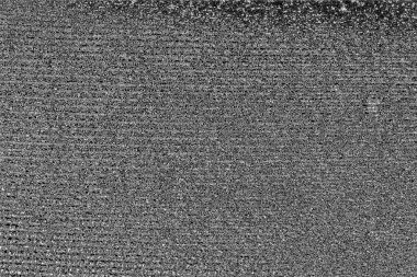 Çizik ve çatlaklarla dolu gri bir doku.