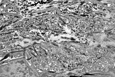 Çizik ve çatlaklarla dolu gri bir doku.