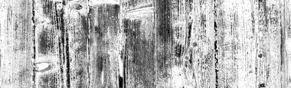 Old plank wooden wall background. The texture of old wood. Weathered piece of wood.