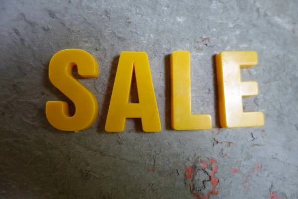 Sale concept. Yellow letters on background