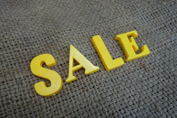 Sale concept. Yellow letters on background