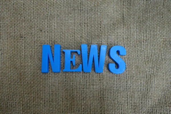 News concept. Blue letters on a background