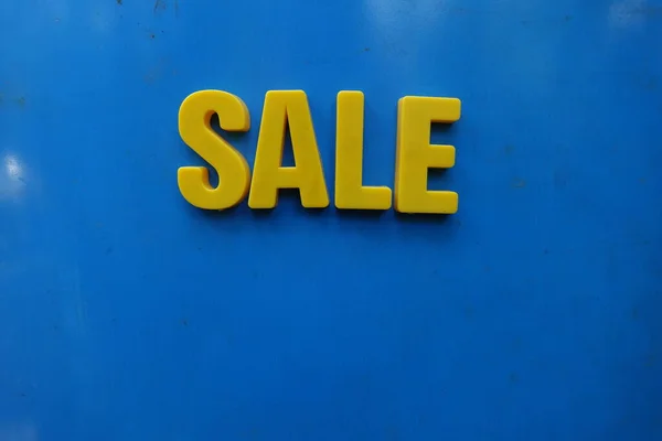 Sale concept. Yellow letters on background