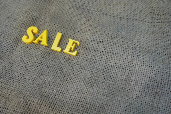 Sale concept. Yellow letters on background