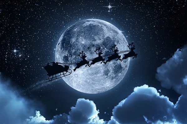 Père Noël volant sur le ciel — Photo