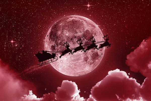 Weihnachtsmann fliegt am Himmel - rot — Stockfoto