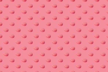 Kusursuz desen. Pembe arka planda pembe badem kurabiyesi deseni. Fransız bademli kurabiyeleri, tatlı, en güzel manzara. Paket kağıdı, poster, tebrik kartı, kapak, fırın