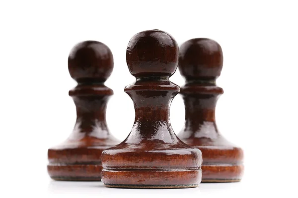 Trzy czarne drewniane szachy sztuk sam na białym tle — Zdjęcie stockowe