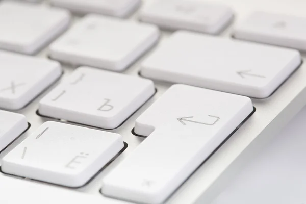 White computer keyboard close-up. Focused on 'Enter' key — Stock Photo, Image