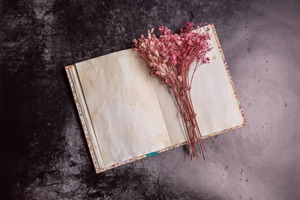 old book and flowers