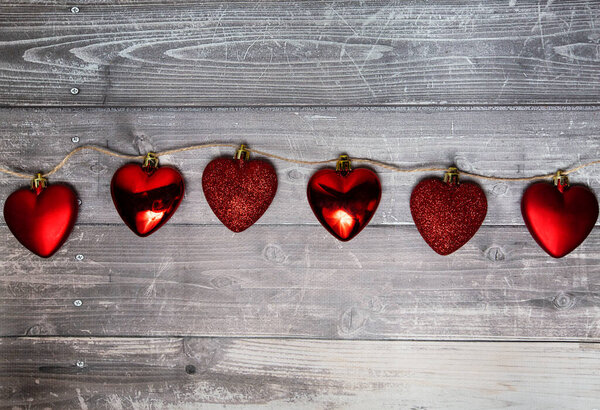 red hearts on a wooden background. valentines day