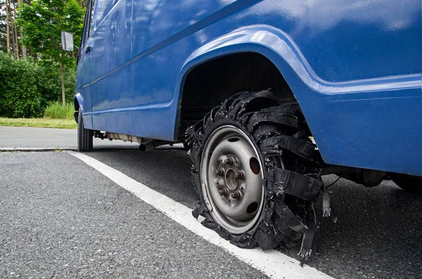 Close Destroyed Blown Out Tire Exploded Damaged Rubber Flat Tyre — Stock Photo, Image