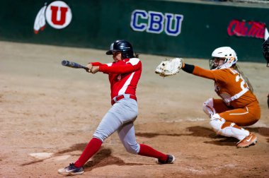 The Texas Longhorns Woman Softball Team Faces Off Against the Mexican Woman National Team in Tournament play clipart
