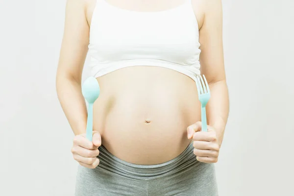 Una Panza Una Mujer Embarazada Con Cuchara Tenedor Cuidado Salud —  Fotos de Stock