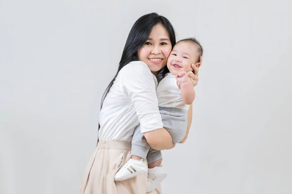 Happy Family Young Asian Mother Hugging Her Newborn Baby Smiling — Stock Photo, Image