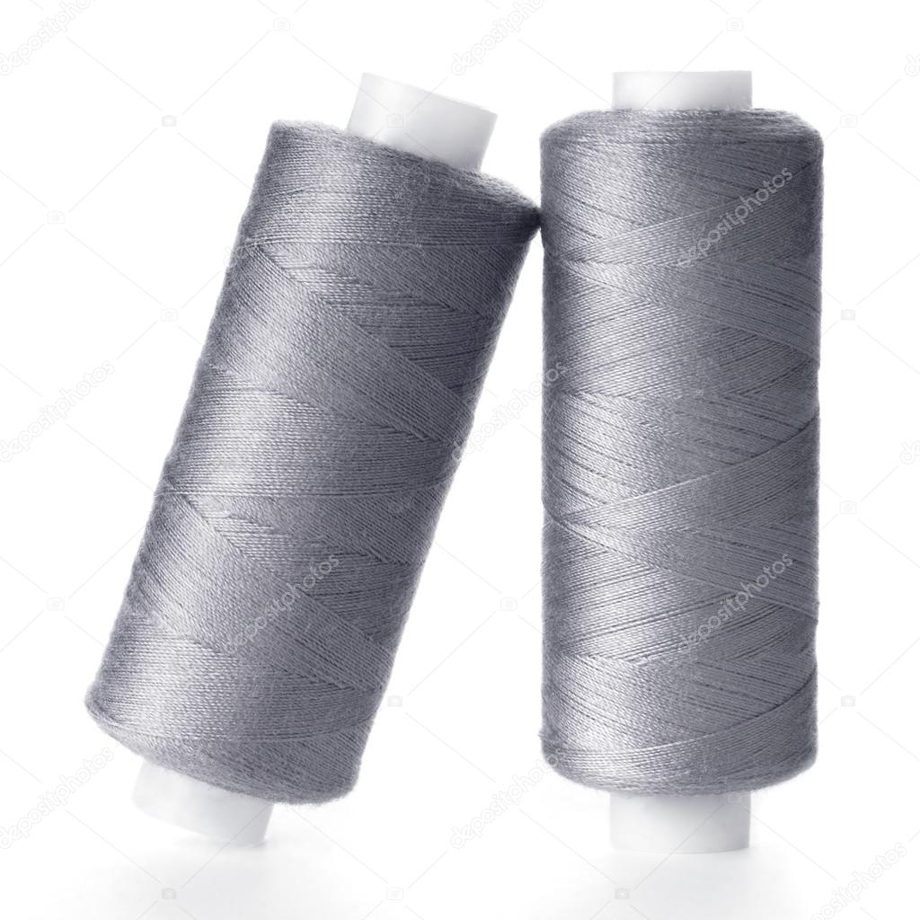 Two reels of gray thread