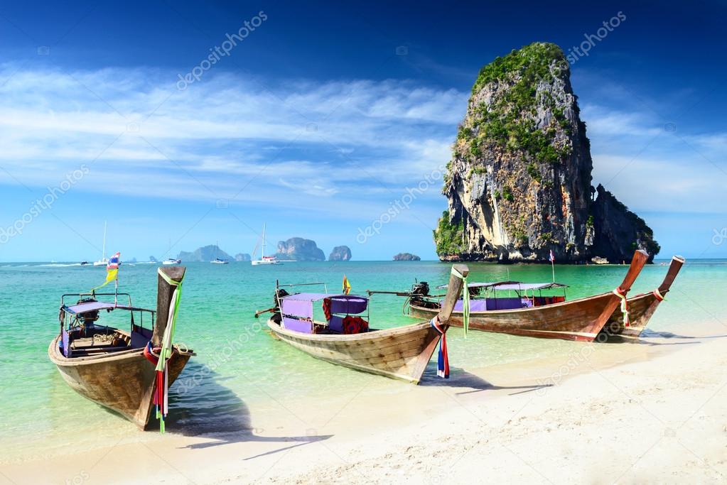 boats on white sandy beach