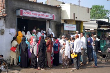 AMRAVATI, MAHARASHTRA, INDIA 12 OCTOBER 2020 : People gather outside Indian government ration store