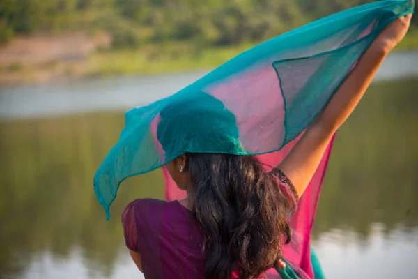 Young Happy Indian Girl Playing Her Pink Scarf Outdoor — Stockfoto