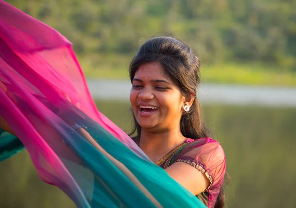 Young Happy Indian Girl Playing Her Pink Scarf Outdoor — Stockfoto