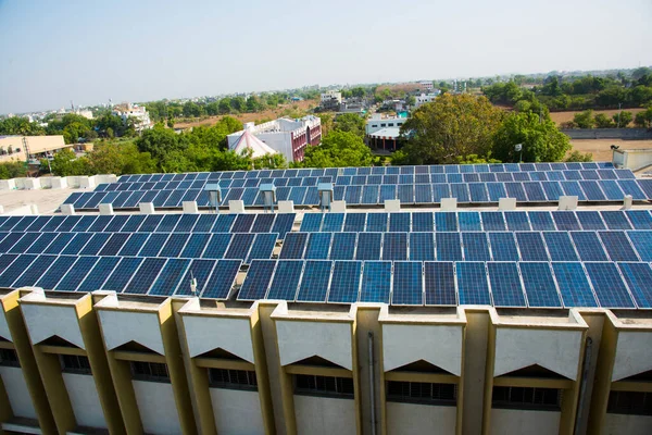 Photovoltaic solar panels on building roof, Regenerative energy system electricity generation, Maharashtra, India.
