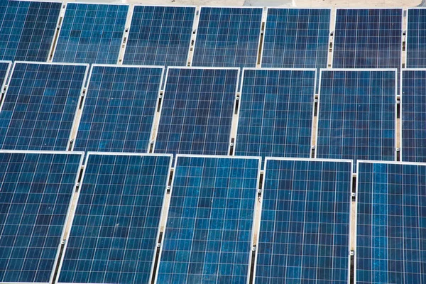 Photovoltaic solar panels on building roof, Regenerative energy system electricity generation, Maharashtra, India.