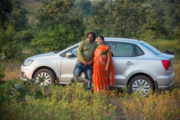 Indian people with a new car.