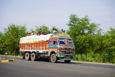 AMRAVATI, MAHARASHTRA, INDIA, May 13, 2020 : Migrants people travel by various vehicles during the lockdown on NH 6, At the beginning of the fourth phase of a nationwide lockdown in Maharashtra.