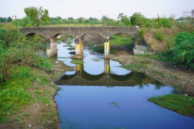 Dirty waste dark black stinking unpleasant odor of water from city.