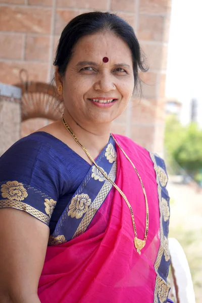 Portrait of smiling Indian woman wearing saree