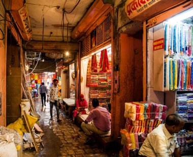 JAIPUR, INDIA 13 AUGUST 2019 : Traders selling Traditional saree and cloth on their Shop, Jaipur, Jaipur is the center of Traditional eastern Handicrafts of India