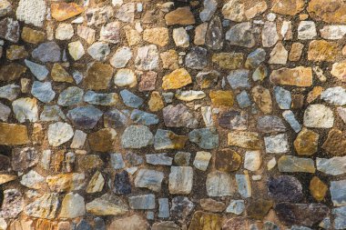 Antik taş duvarın arka planı, eski kale taşı duvar dokusu, taş yüzeylerin deseni..
